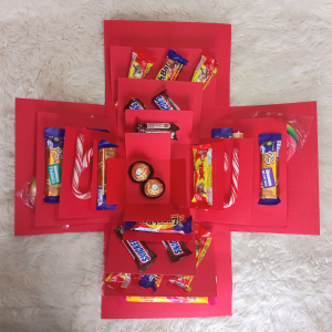 Choco Heaven Explosion Box opened with chocolates and sweets inside